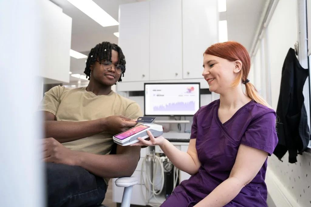 Dental office payment at chairside with handheld terminal