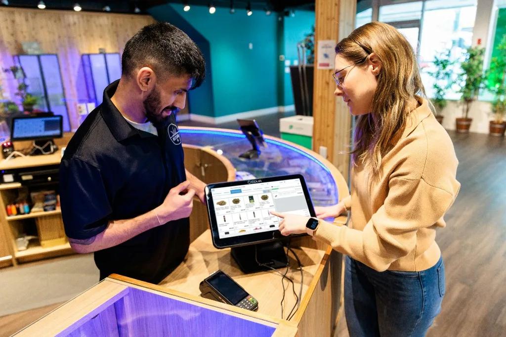 Retail counter with tablet POS and customer interaction