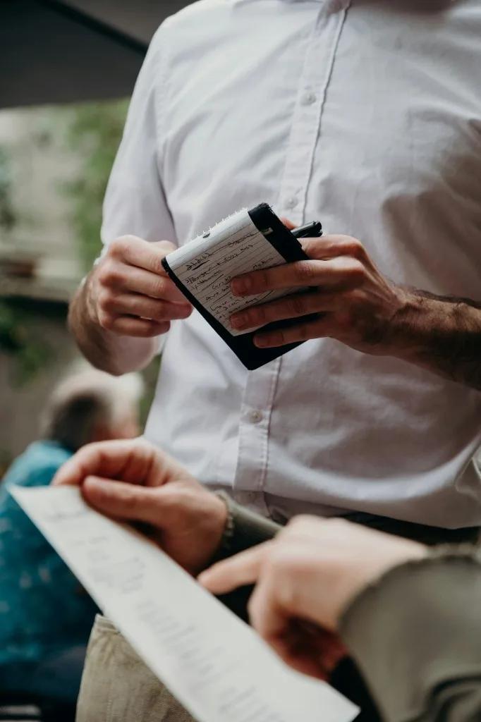 Waiter recording tableside orders
