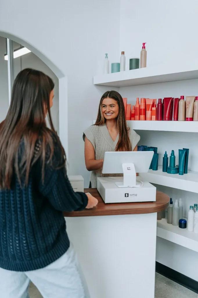 Apparel retail associate with customer