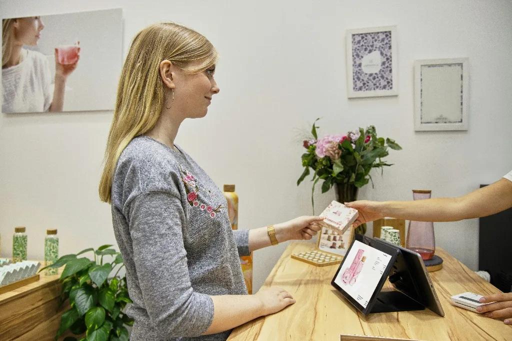 Boutique retail checkout with mobile card reader on counter
