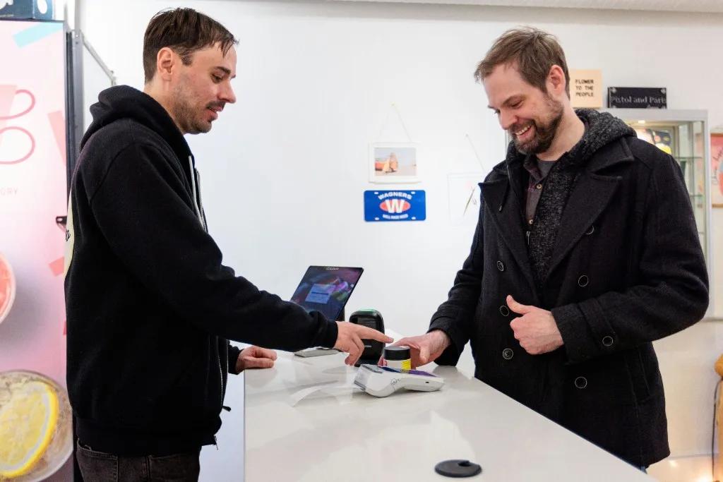Retail counter with tablet POS and customer